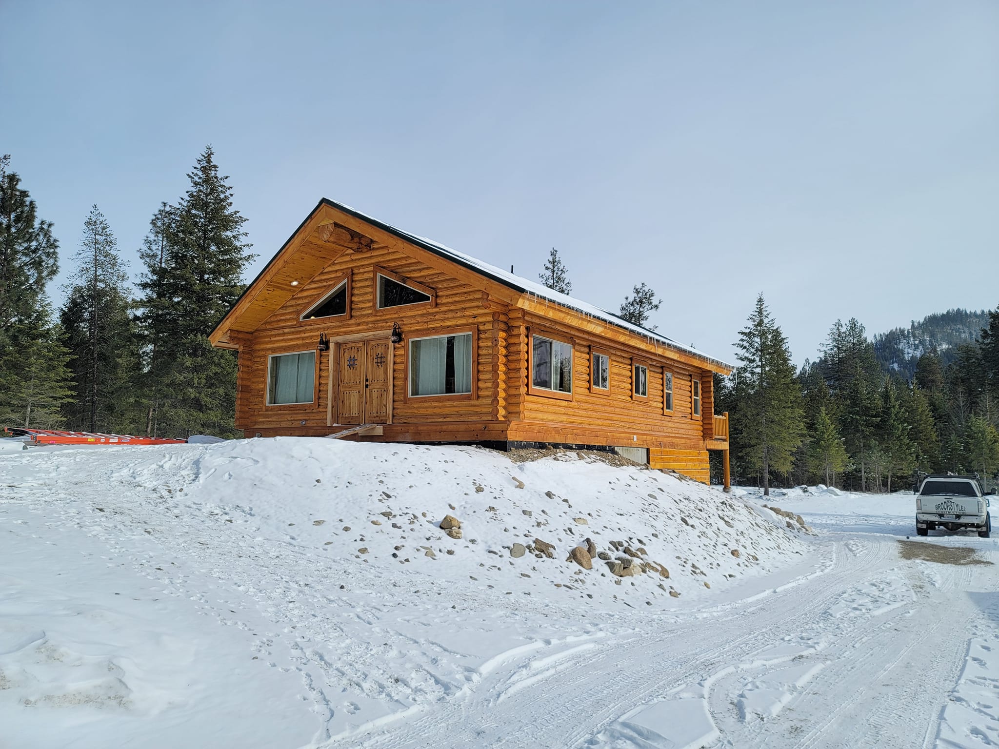 Log home exterior in winter mountain setting