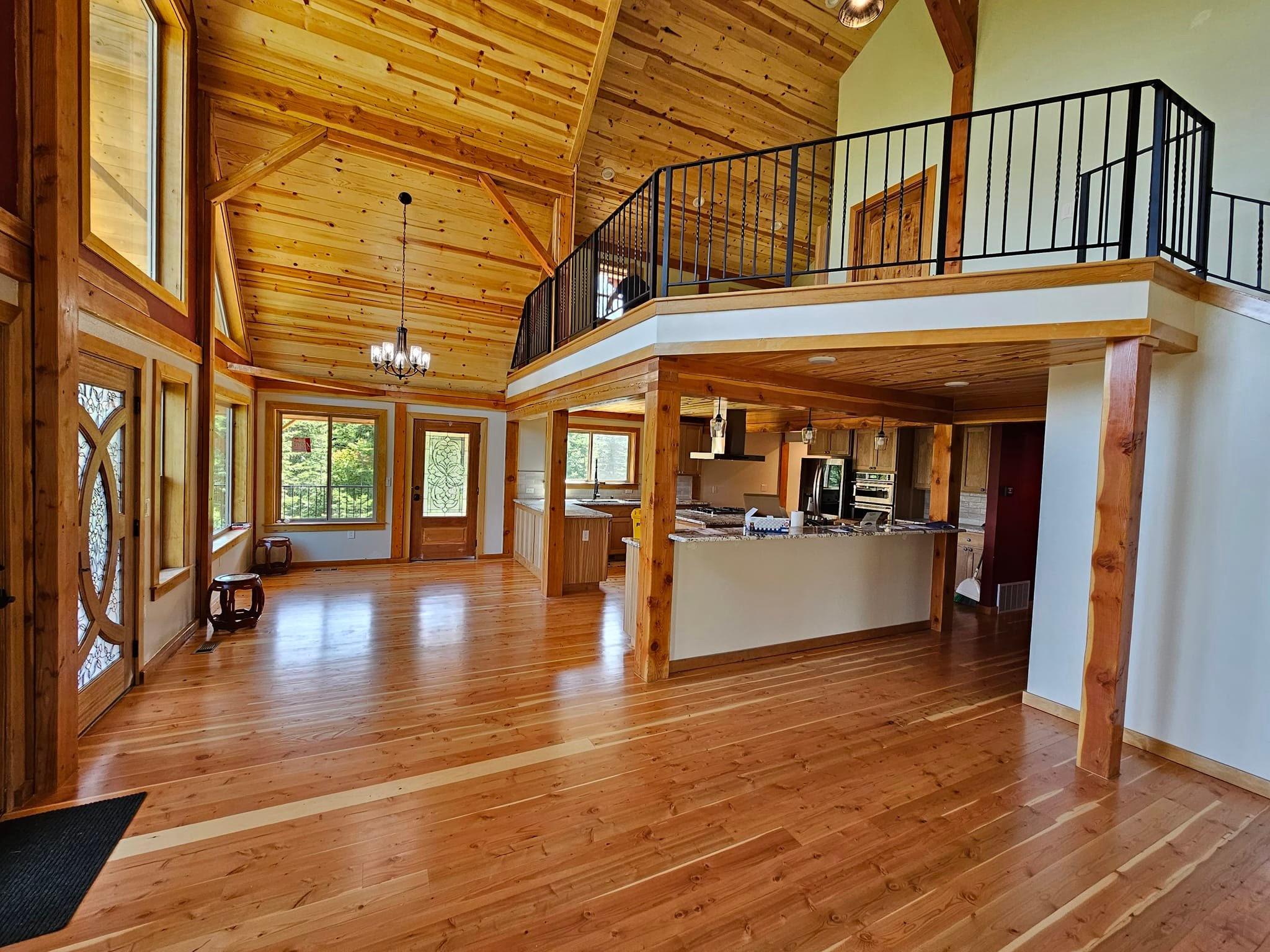 Open concept log home with timber loft