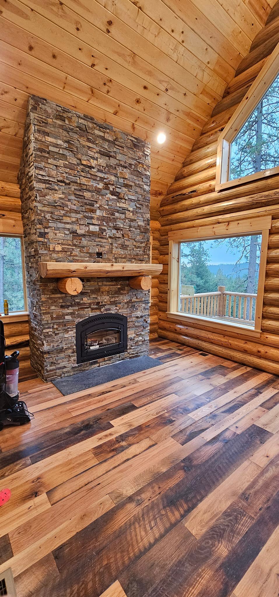 Cozy log home interior with stone fireplace